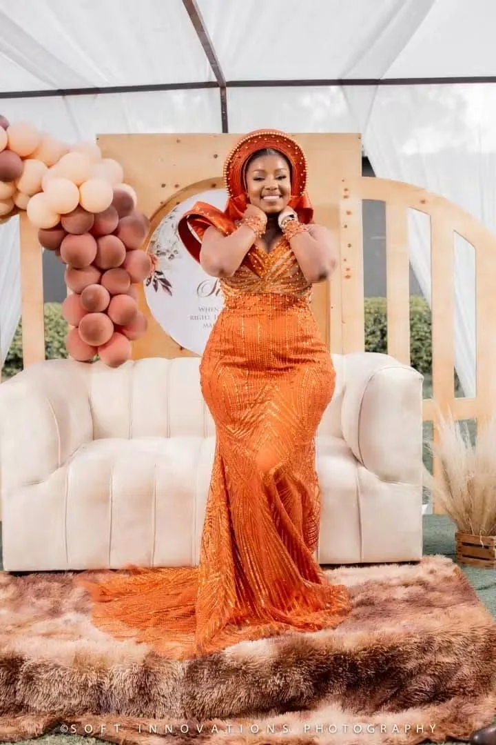 Nyasha in her orange roora gown and headwrap in Harare — founder's pre-Caronai experience, planned and coordinated by Tanaka