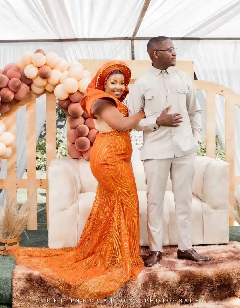 Nyasha in beaded orange and Simba in beige at their roora ceremony in Harare — founder's pre-Caronai experience, planned and coordinated by Tanaka