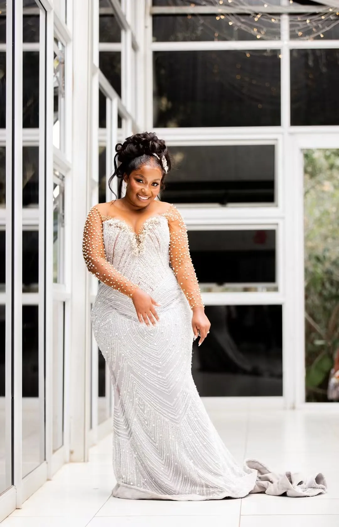 Nyasha in her pearl-beaded wedding gown at her Harare wedding — founder's pre-Caronai experience, planned and coordinated by Tanaka